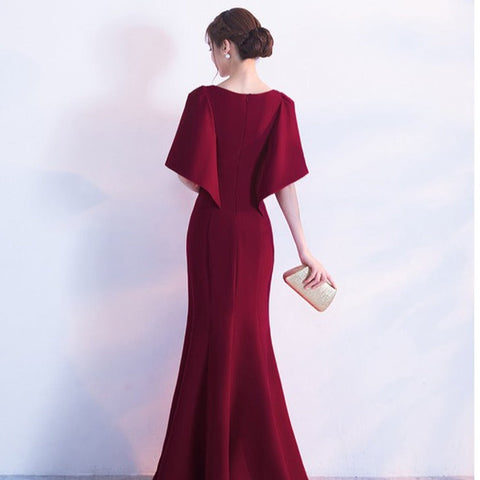 Elegant cape style trumpet gown